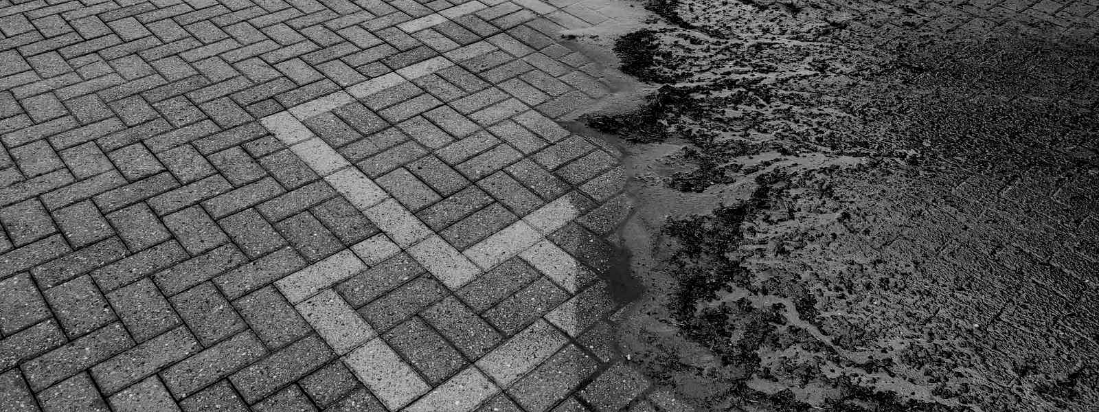 Driveway during jet washing or power washing